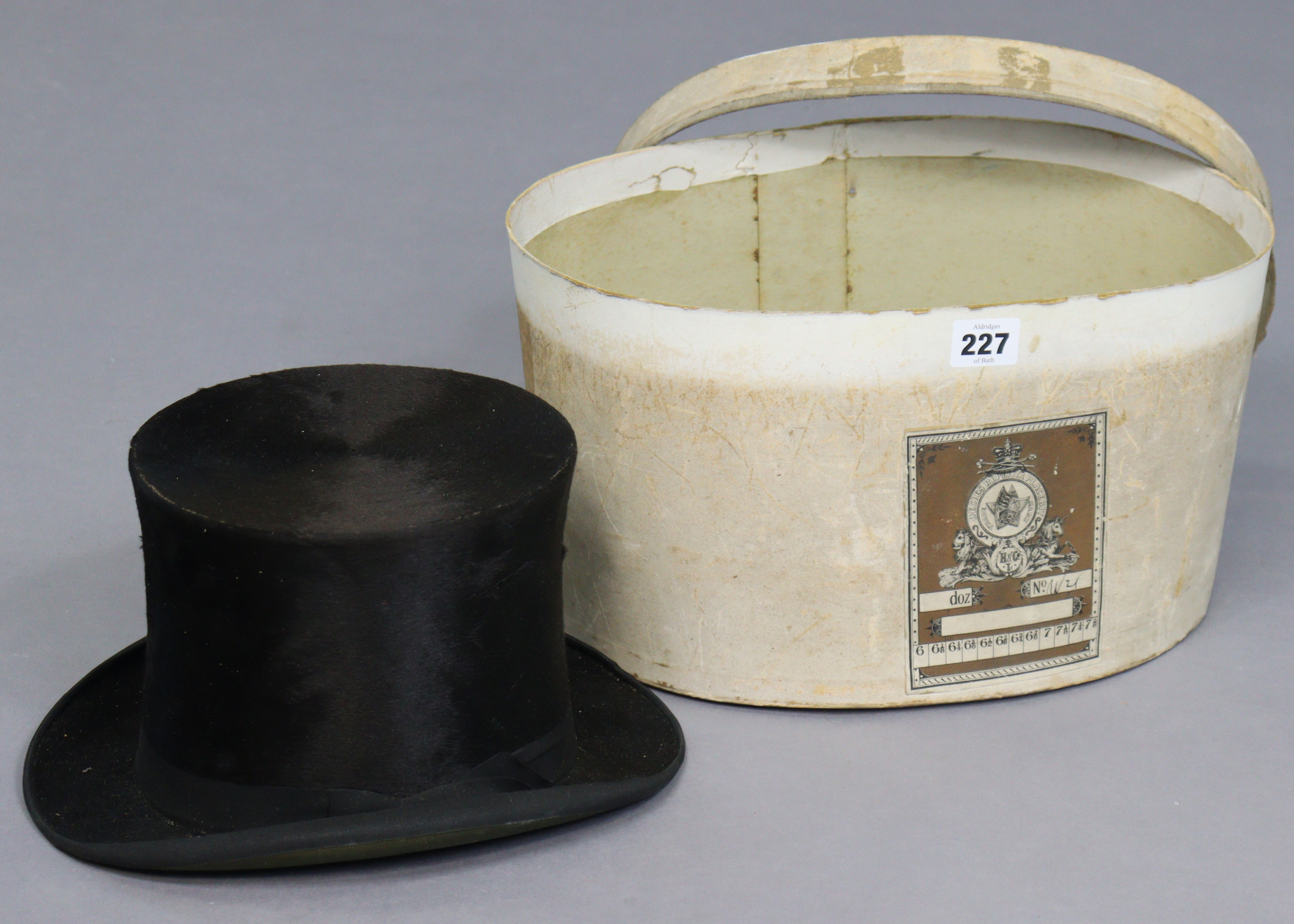 A vintage black silk top hat; & a cardboard hatbox (hatbox w.a.f.).