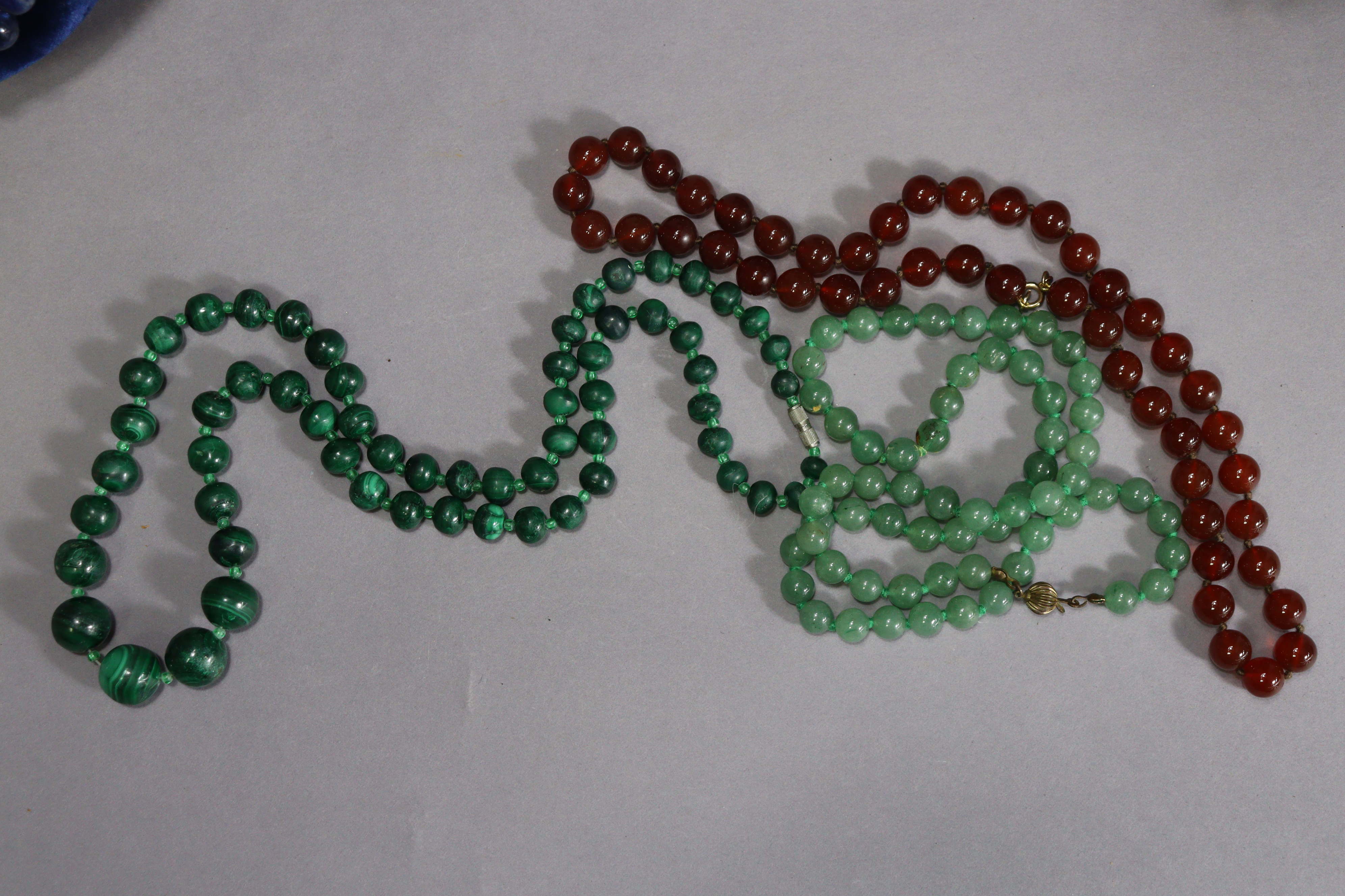 A collection of various bead necklaces including coral, turquoise, malachite, etc., contained in a - Image 12 of 14