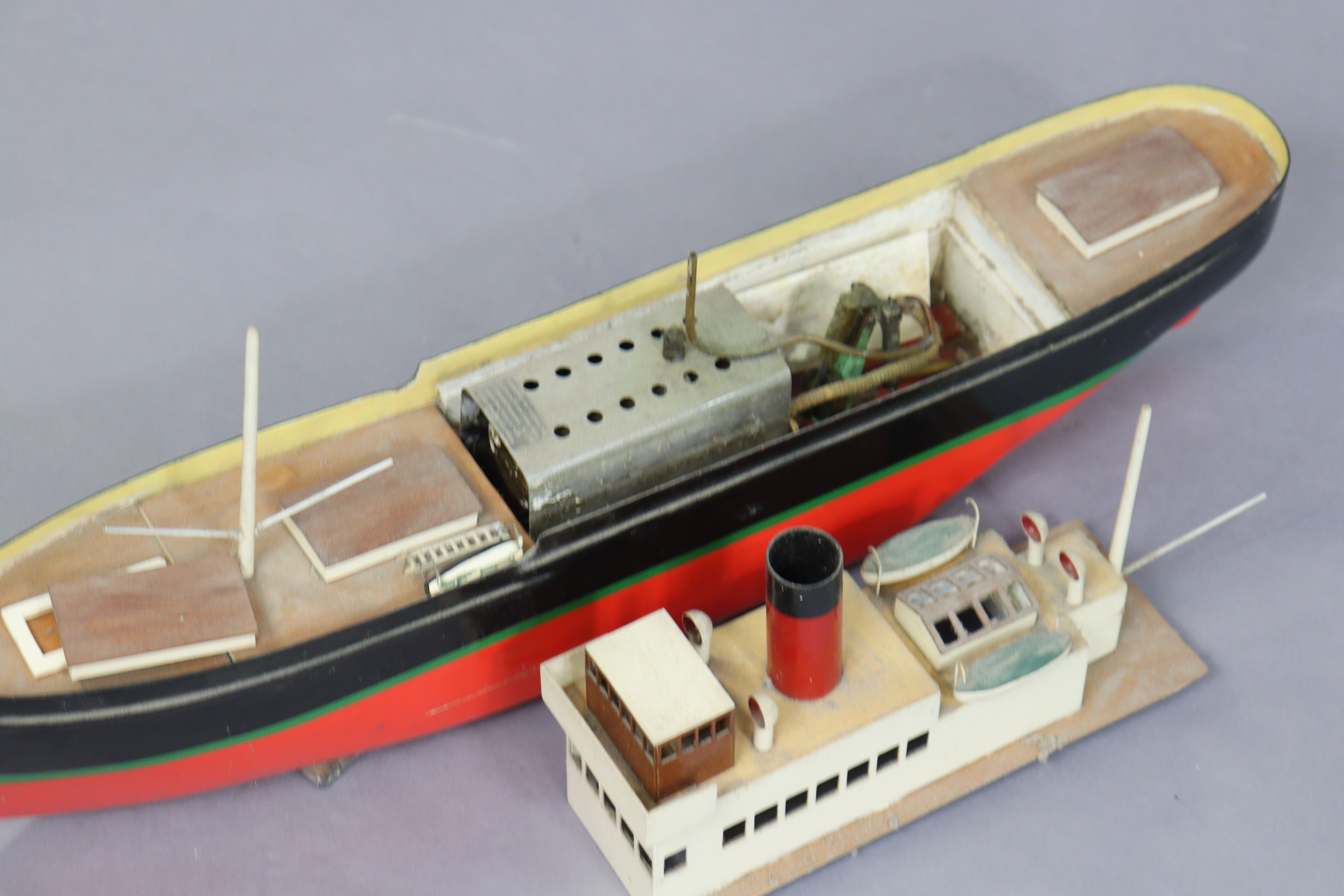 A painted wooden & metal model steamboat fitted with a Mamod engine, 69cm long, and a painted wooden - Image 4 of 7