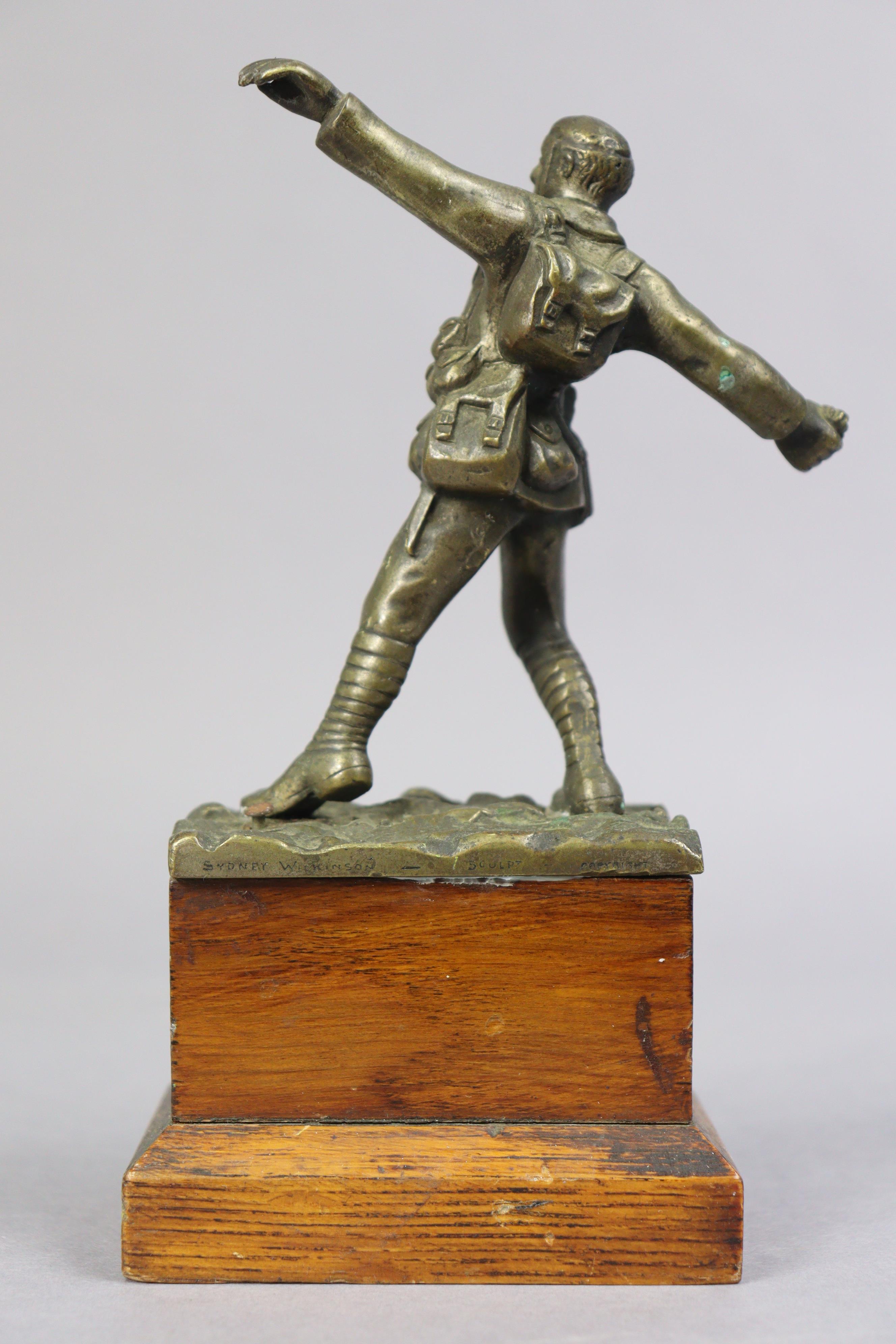 A bronzed sculpture of a WWI standing soldier figure throwing a grenade, signed to reverse “Sydney - Image 3 of 4