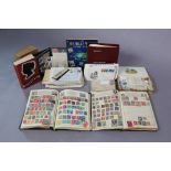 A collection of world stamps in three albums & a stock-book; a quantity of loose stamps; various