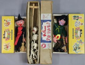 Three Pelham string puppets “Giant”, “Skeleton”, and “Witch” all boxed.