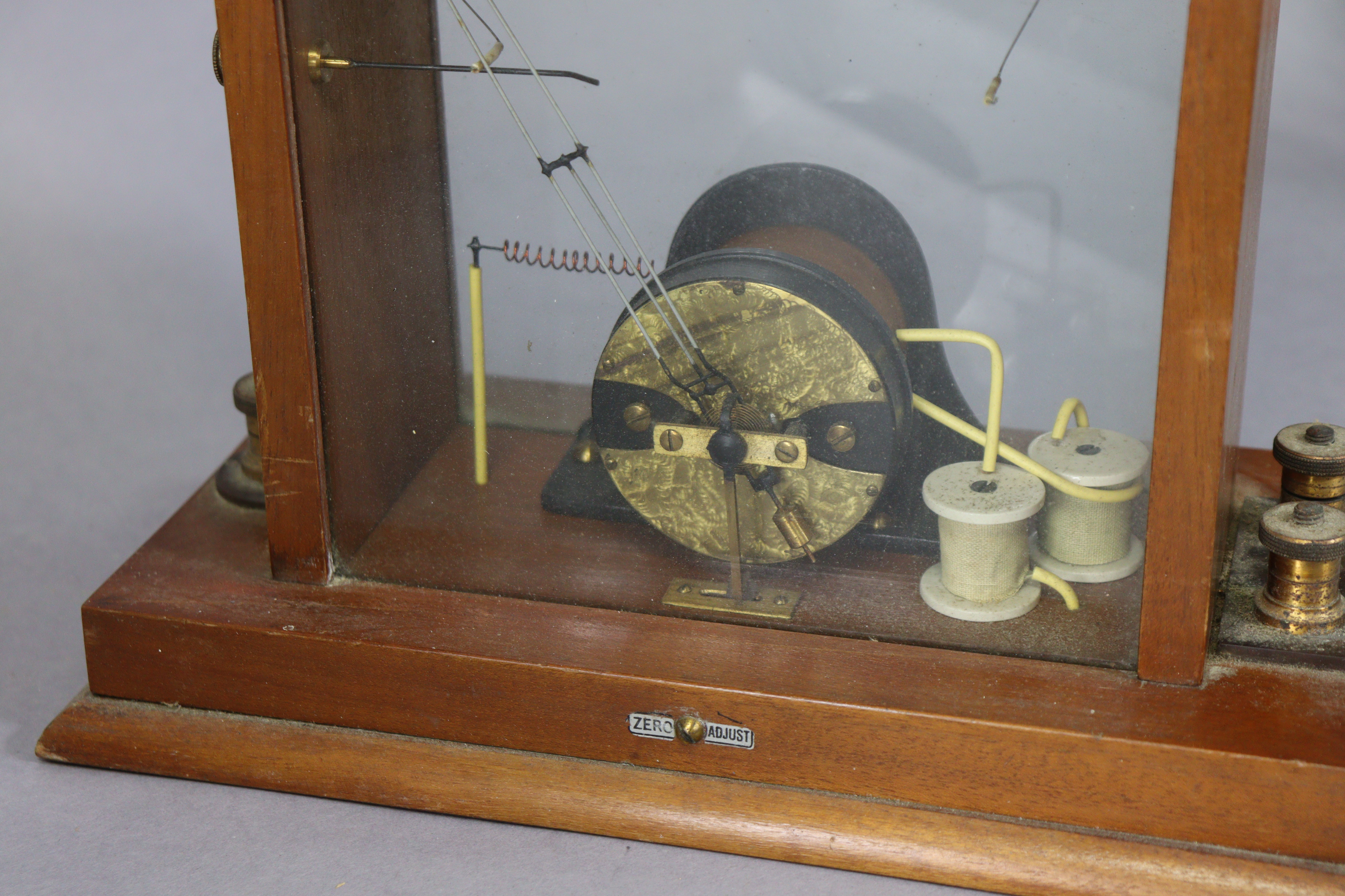 A vintage electric-shock instrument by the Cavendish Electrical Co of London in a mahogany case, and - Image 7 of 8