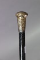 A George V ebony walking cane with an engraved silver knob handle, London 1925, 93cm high.