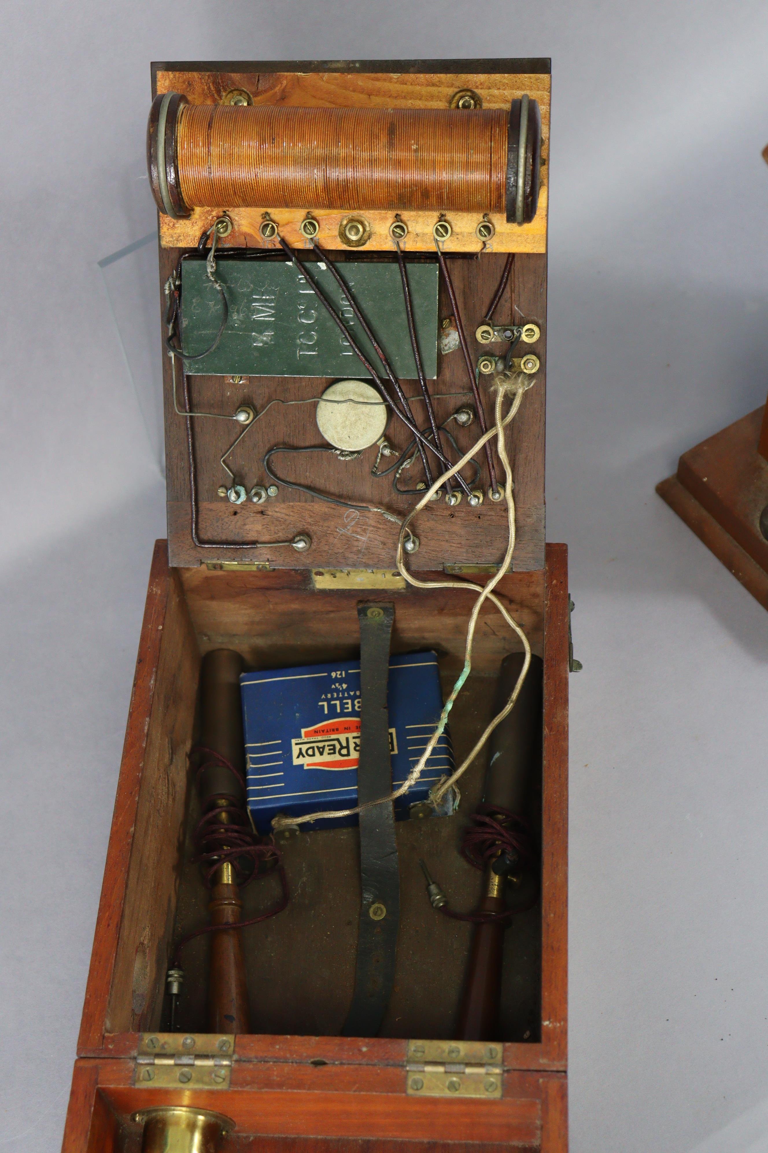A vintage electric-shock instrument by the Cavendish Electrical Co of London in a mahogany case, and - Image 4 of 8