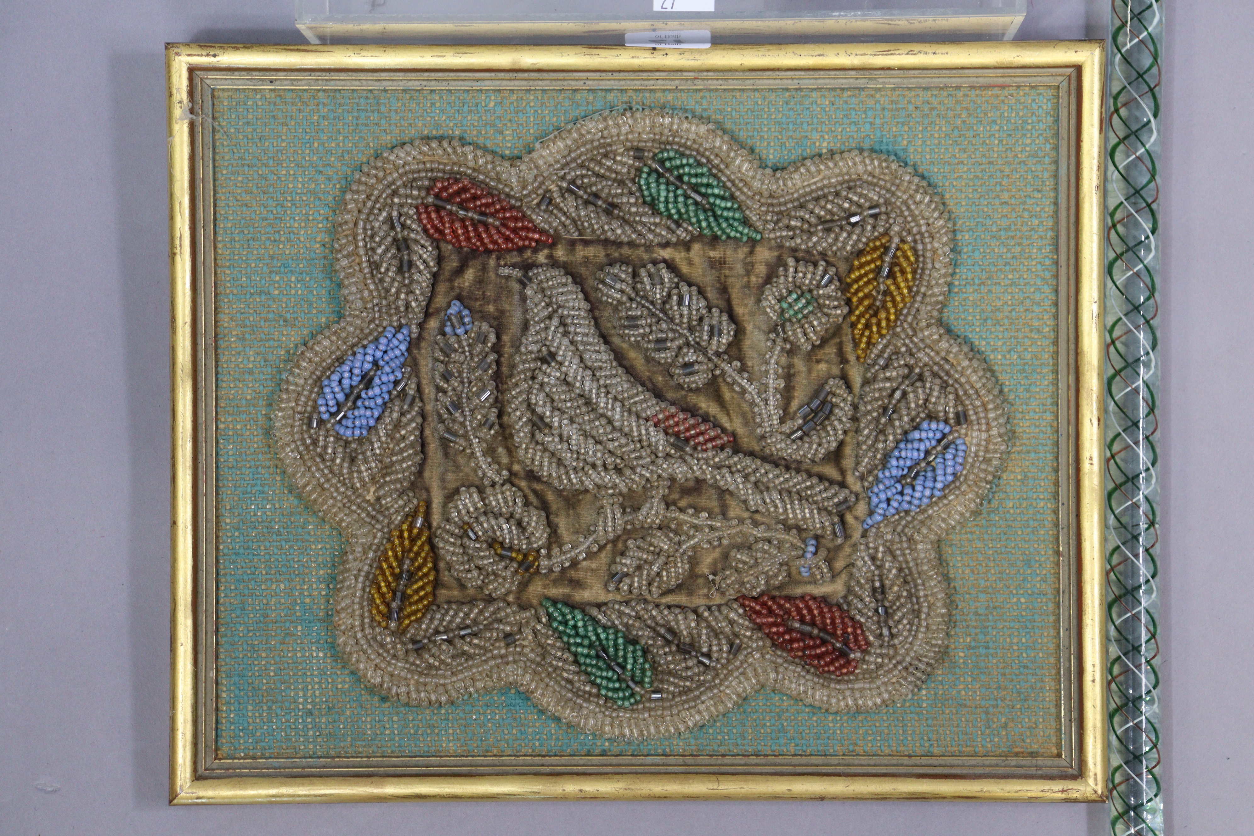An early 20th century beadwork panel depicting a bird amongst flowers, 24cm & 30.5cm, in a gilt - Image 3 of 5