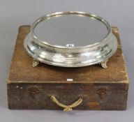 A late 19th/early 20th century engraved silver-plated cake-stand on four short cabriole legs & inset