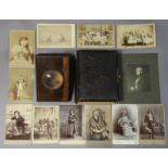 An Edwardian black Morocco-leather covered photograph album; a treen photocard viewer; & various