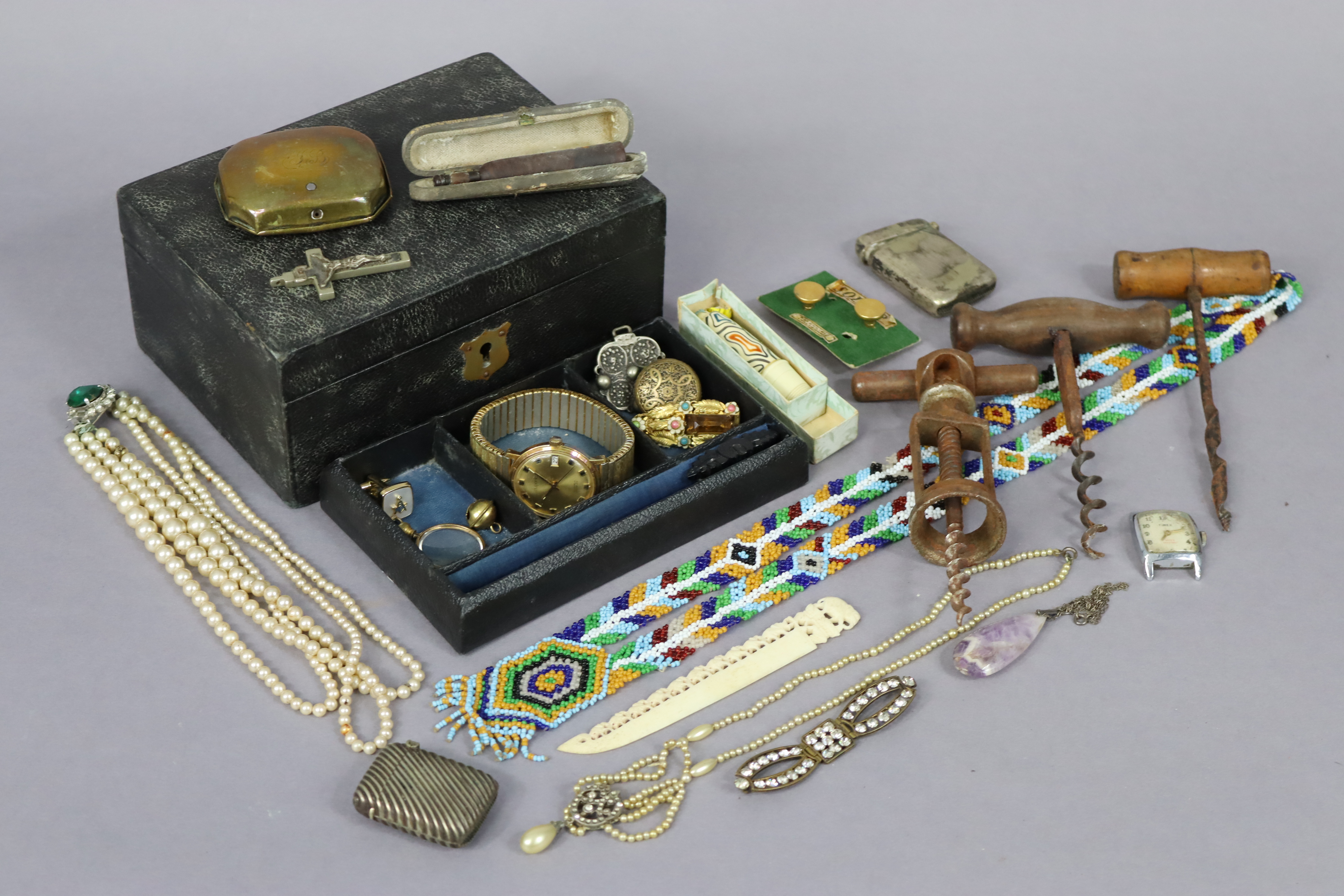 Two silver plated vesta case; a cheroot holder, cased; a brass snuffbox; three cork screws; & a