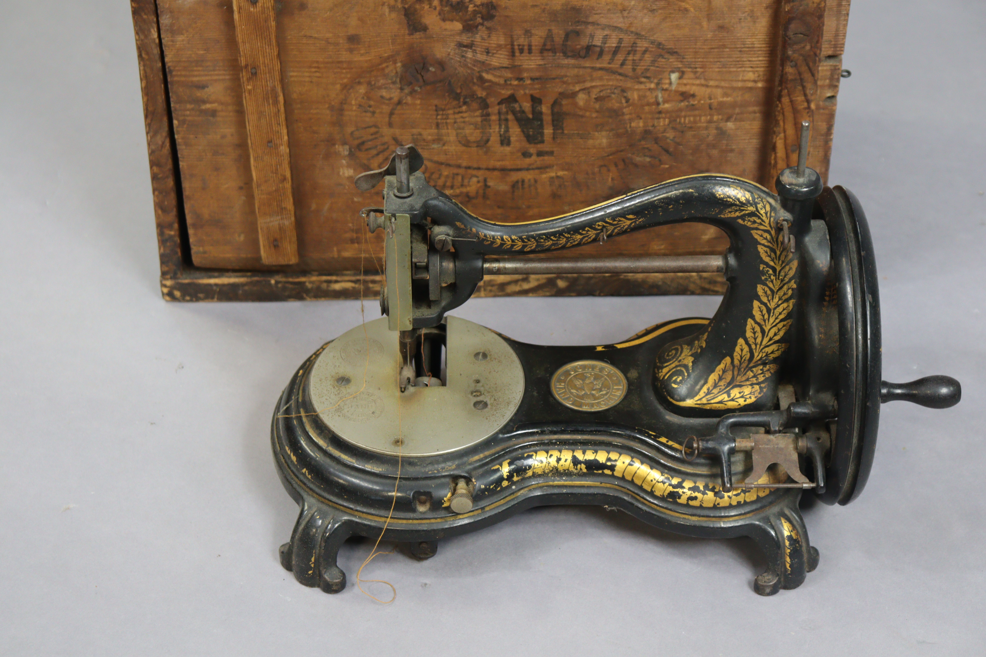 A vintage Jones serpentine cat-back sewing machine with gilt foliate decoration, 38cm wide, with - Image 2 of 6