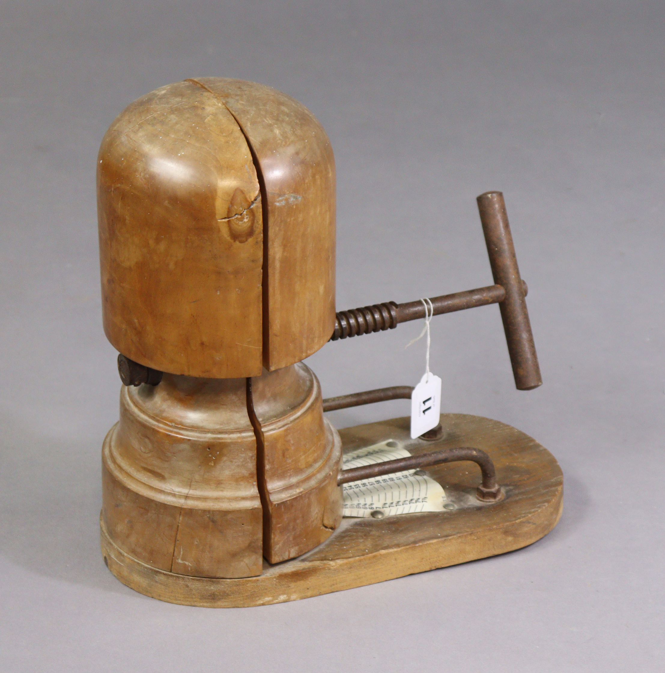 Another late 19th/early 20th century milliner’s wooden adjustable hat stretcher with iron