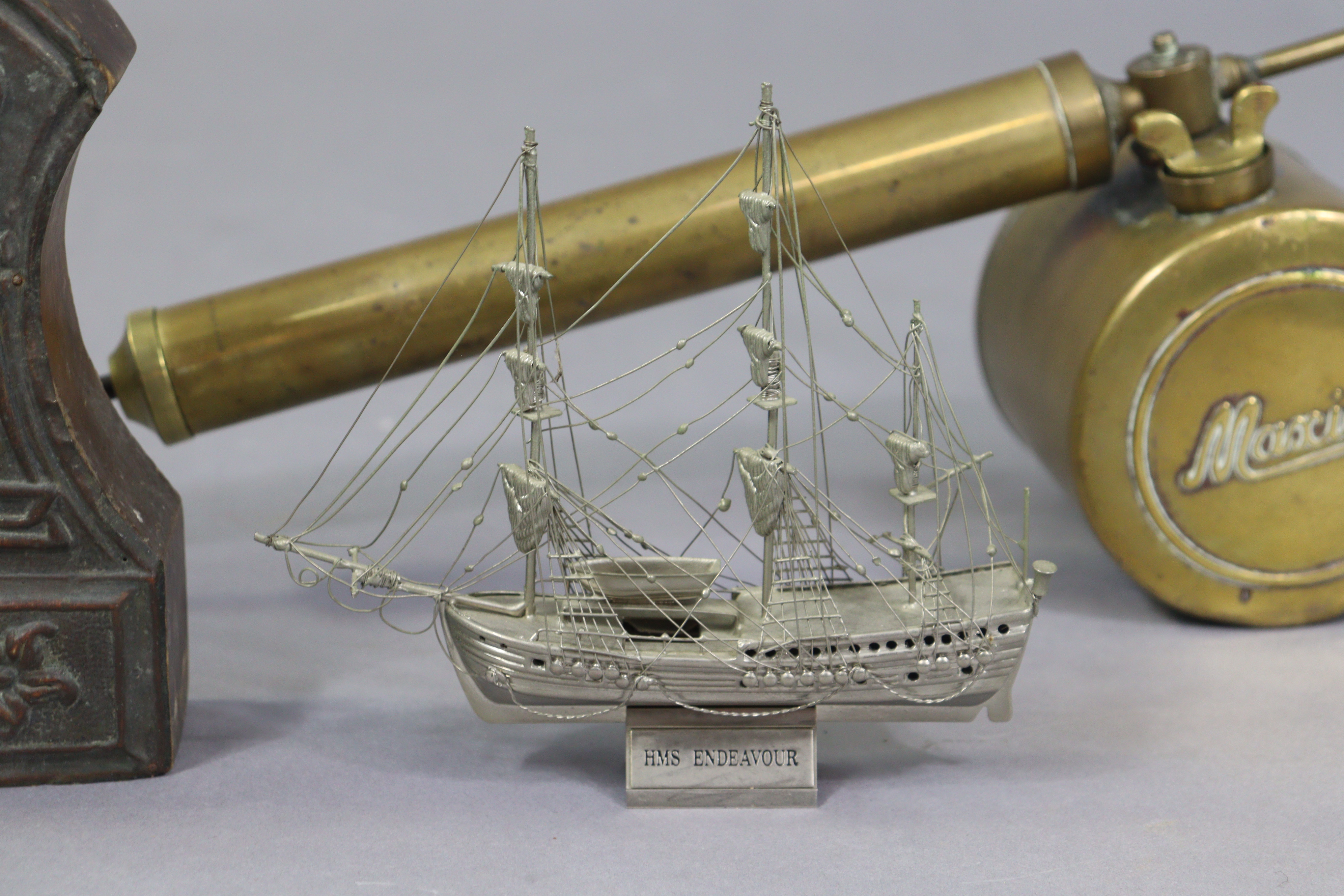 A white-metal model of “HMS Endeavor”, 16cm wide; a vintage maxima brass plant sprayer; & an art - Image 3 of 5