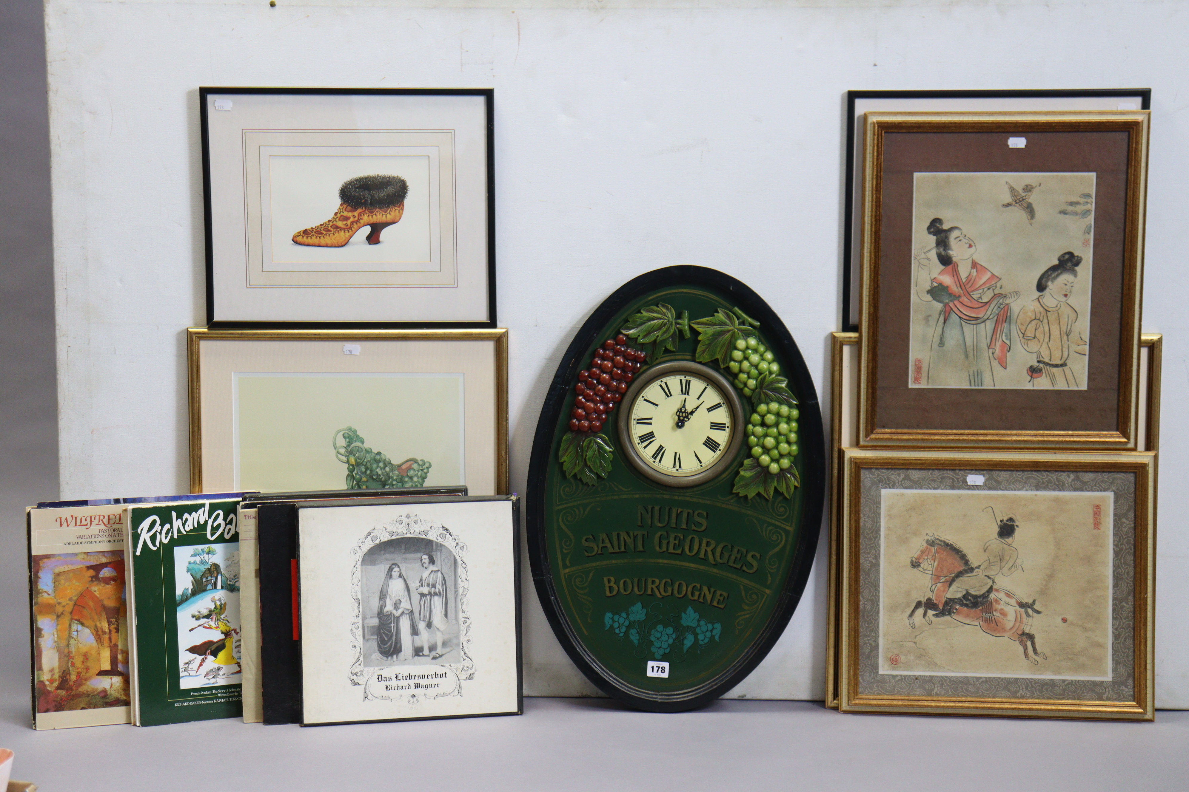 A modern French battery-operated wall clock, 65cm x 43cm; together with six coloured prints. - Image 2 of 2