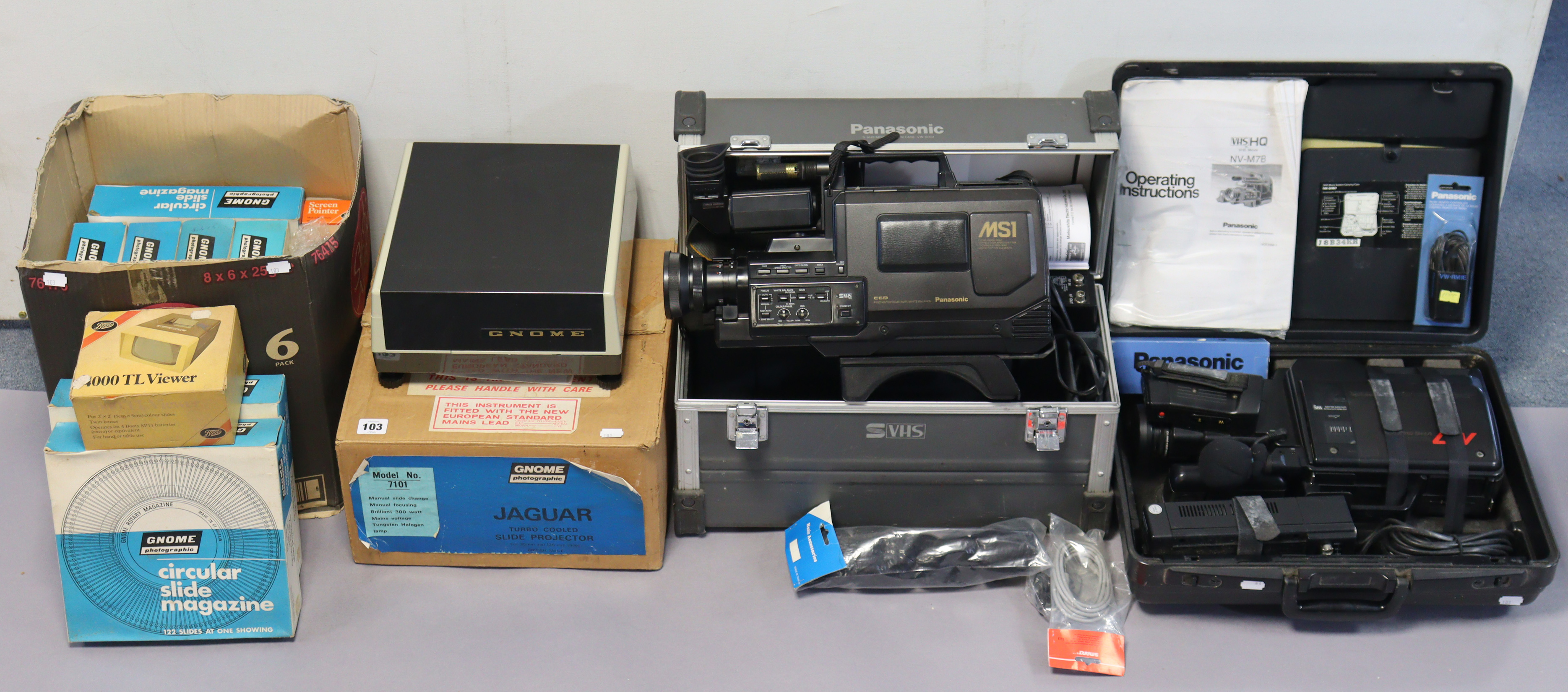 Two Panasonic VHS movie cameras, both cased, a Jaguar slide-projector, boxed, and various circular