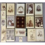 A small crimson plush-covered photograph album; together with a quantity of assorted carte-de-visite