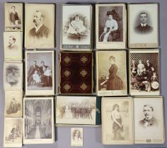 A small crimson plush-covered photograph album; together with a quantity of assorted carte-de-visite