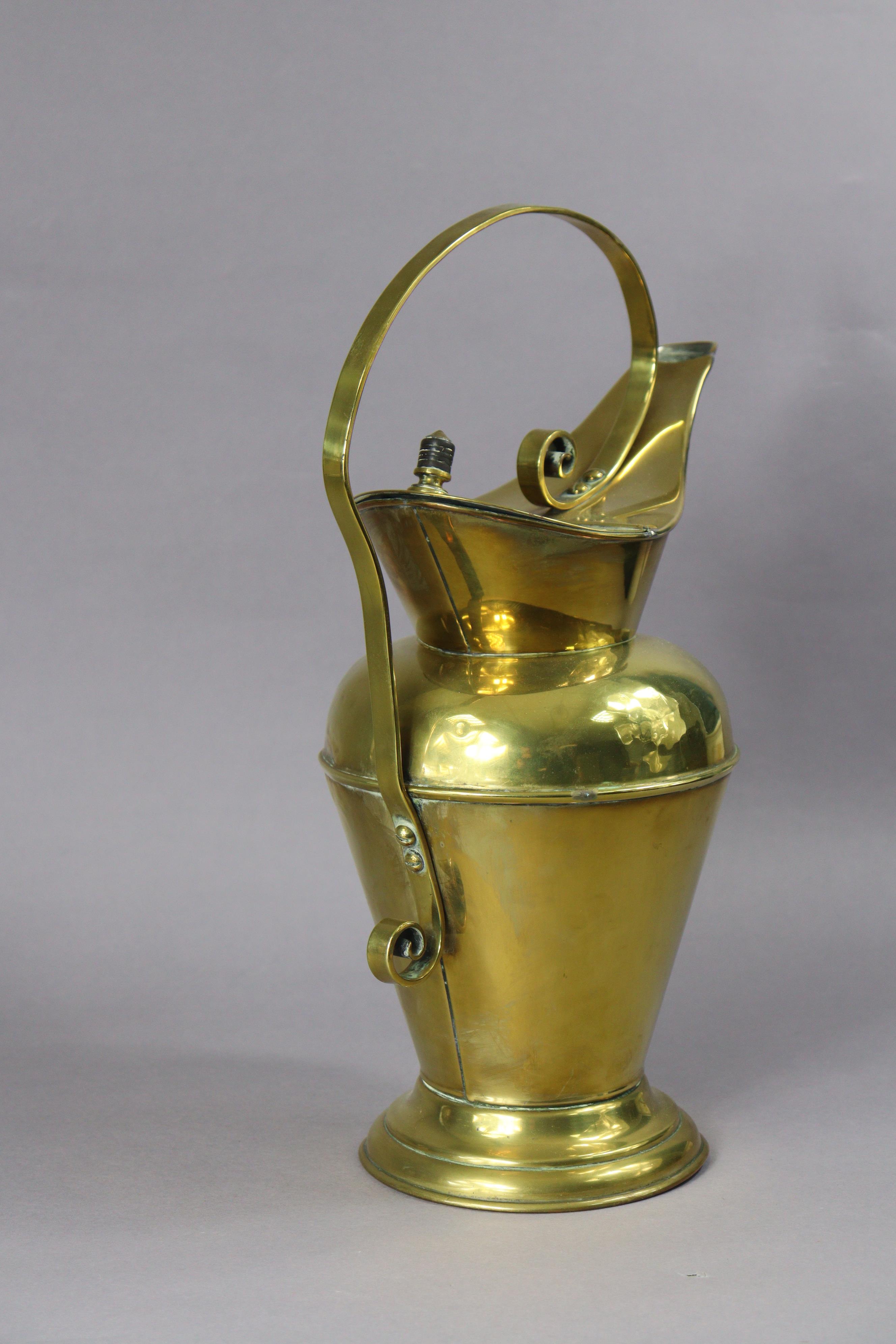 A late 19th century brass water jug designed by Christopher Dresser for Benham & Froud, with - Image 3 of 7