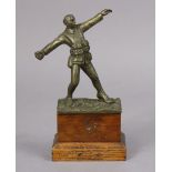 A bronzed sculpture of a WWI standing soldier figure throwing a grenade, signed to reverse “Sydney