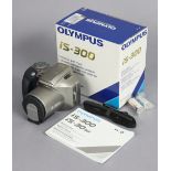 An Olympus “IS-300” camera, boxed.