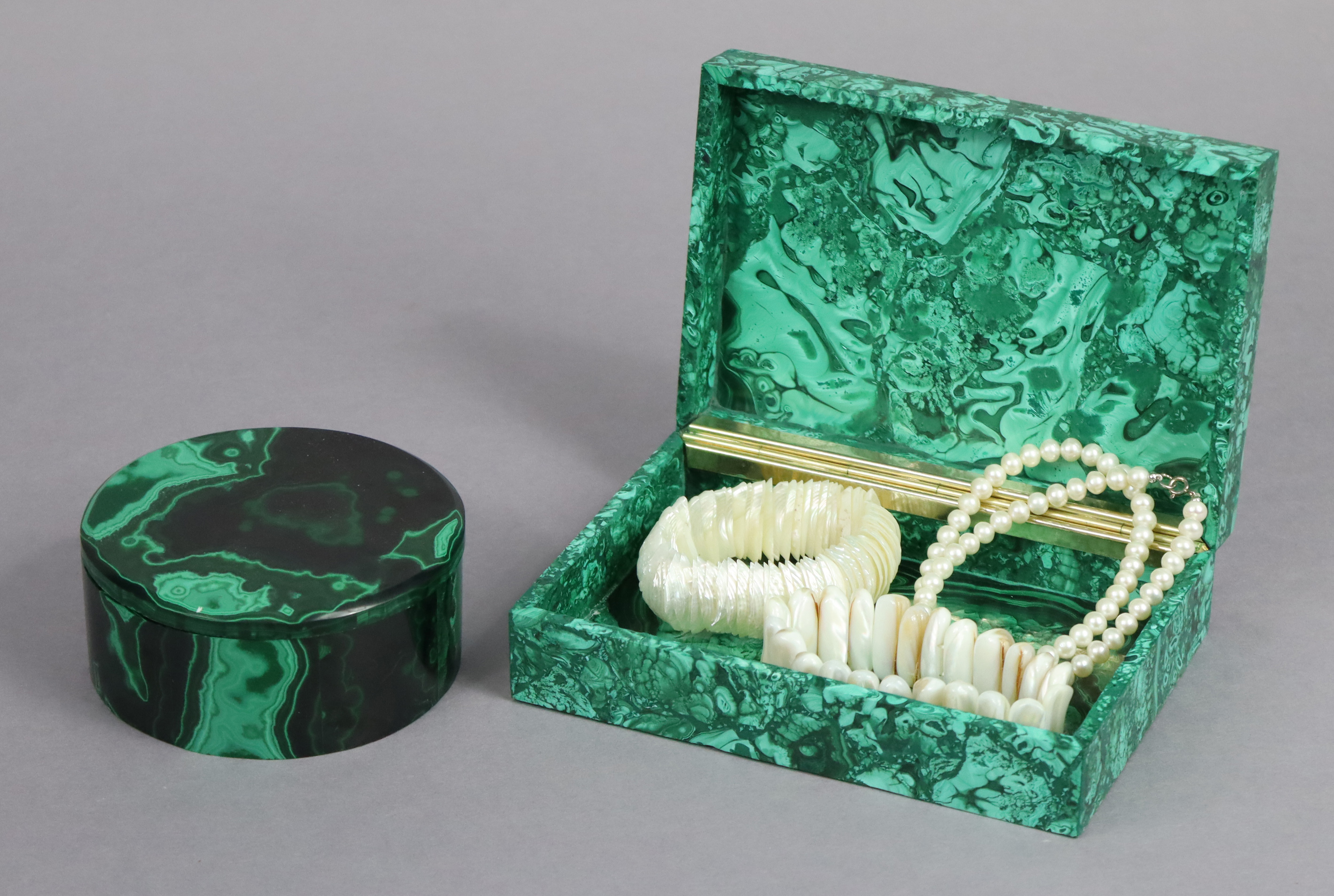 A Malachite rectangular trinket box, 15.75cm wide; a ditto circular trinket box, 10 cm diameter, &