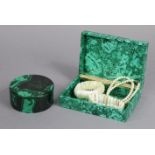 A Malachite rectangular trinket box, 15.75cm wide; a ditto circular trinket box, 10 cm diameter, &