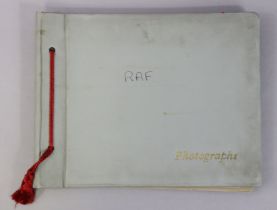 A WWII photograph album containing numerous photographs, postcards, & ephemera all relating to R.A.