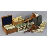Two vintage wooden stereo-card viewers, and various stereo-view cards, and card boxes.