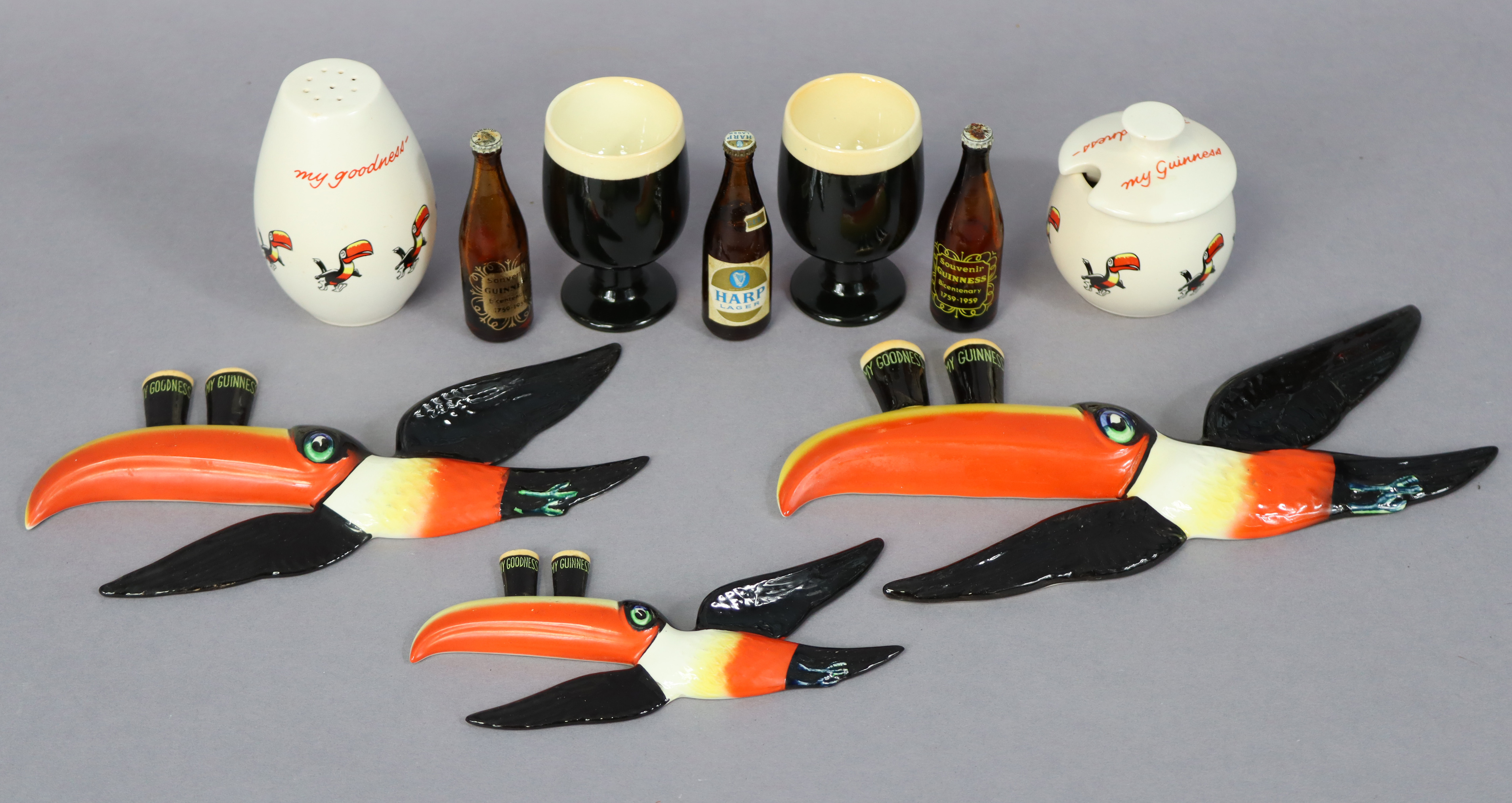 A set of three carlton ware “Guiness” graduated toucan wall ornaments (the largest waf), two