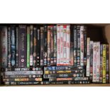 Approximately one hundred various DVDs.