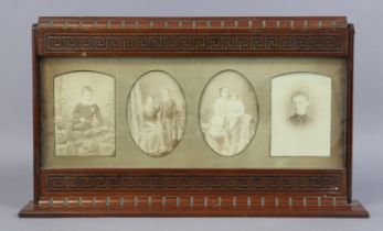 A late 19th/early 20th century carved mahogany table standing photograph frame, 54cm wide x 31cm