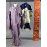 A Japanese silk-lined kimono of blue ground with multi-coloured design of an eagle to the back, with