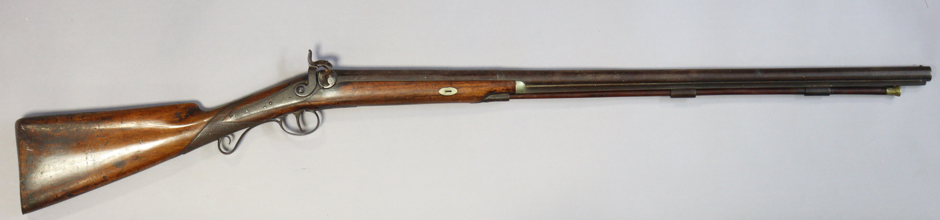 A 19th century percussion rifle with a carved hardwood butt & wooden ramrod, with 80.5cm long