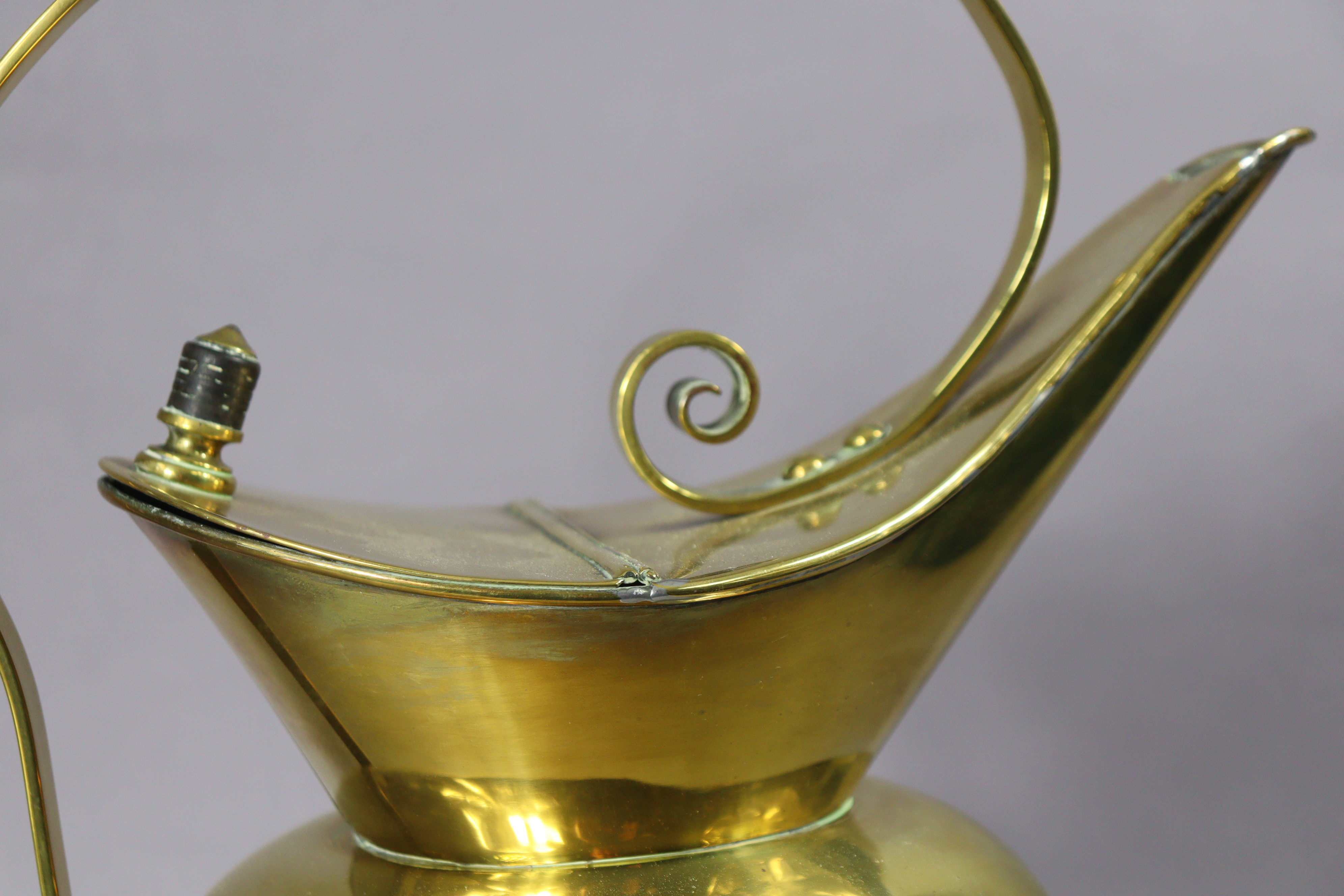 A late 19th century brass water jug designed by Christopher Dresser for Benham & Froud, with - Image 6 of 7