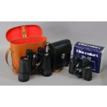 A pair of Atlas 10 x 50mm field glasses, cased; & a pair of Kigyo 8 x 30mm field glasses, cased &