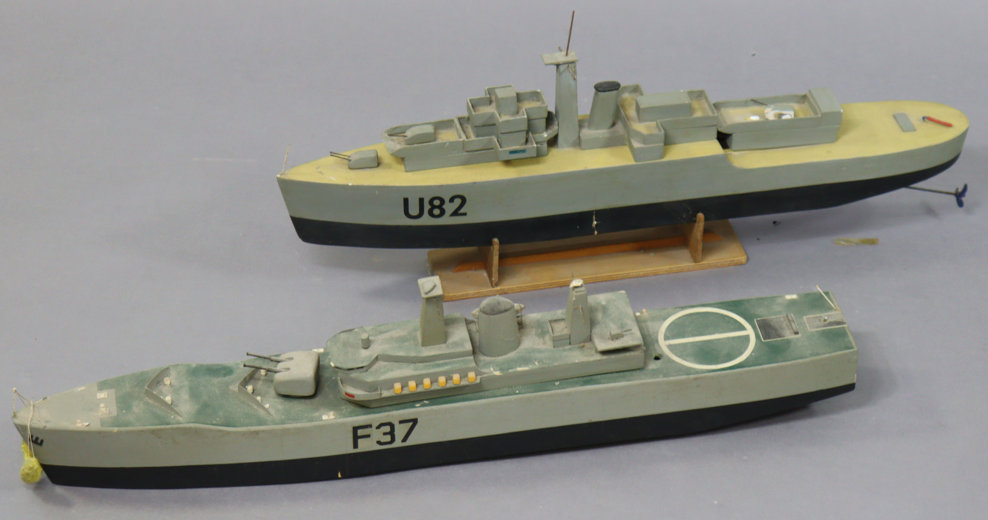 Two painted fibreglass models of warships “F37” 75cm long, and “V82” 70cm long.