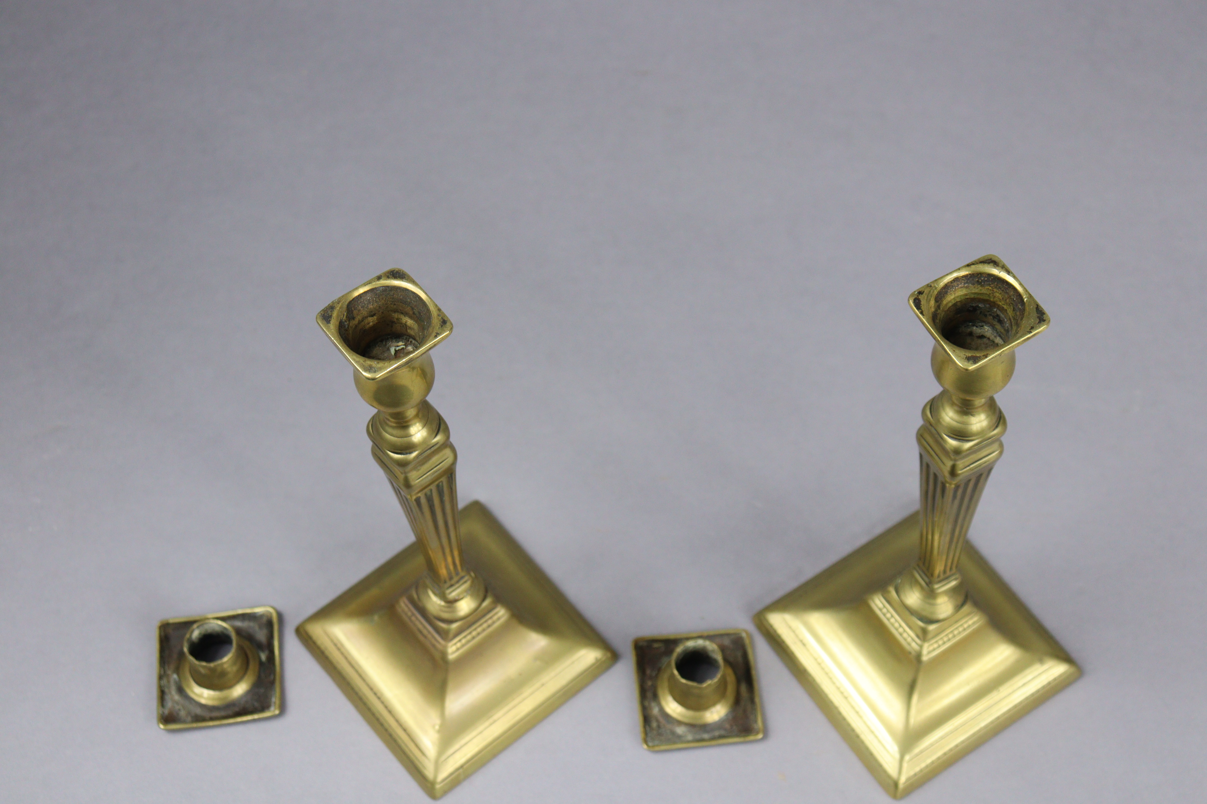 An 18th century brass candlestick, 20cm high; two pairs of Victorian candlesticks, 26.5cm & 24.5cm - Image 4 of 8