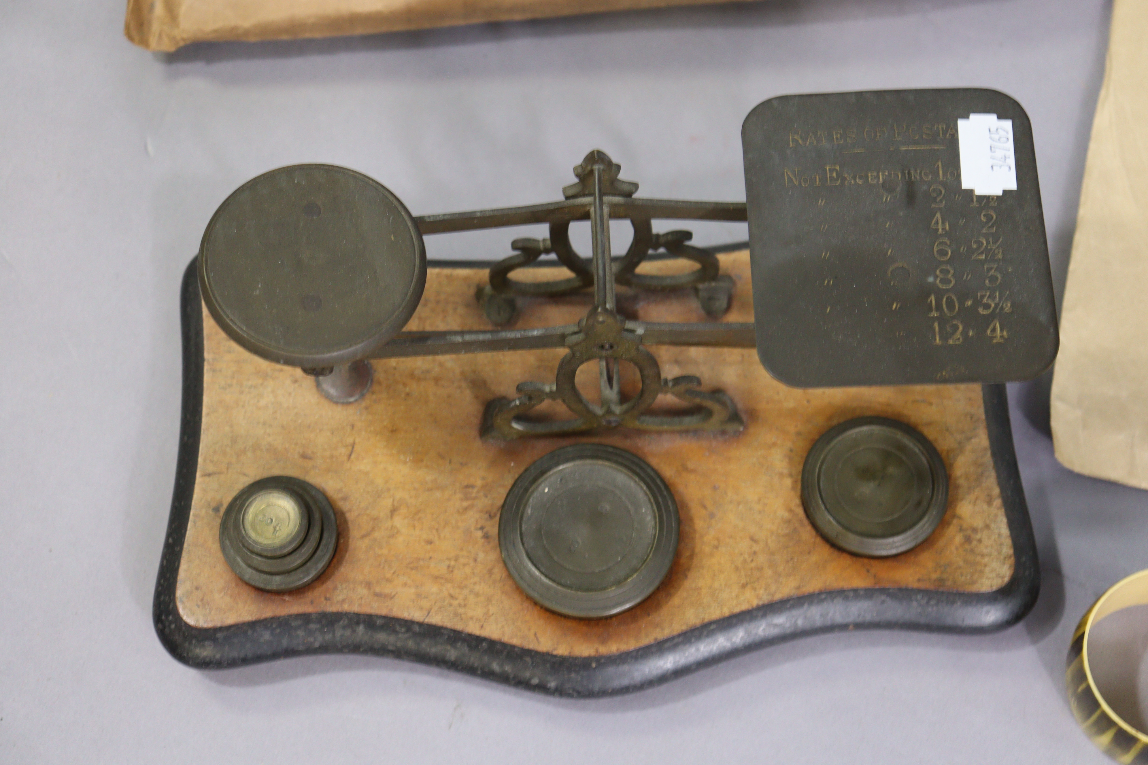 A vintage brass letter scale mounted on a wooden serpentine-front base, with weights; together - Image 2 of 7