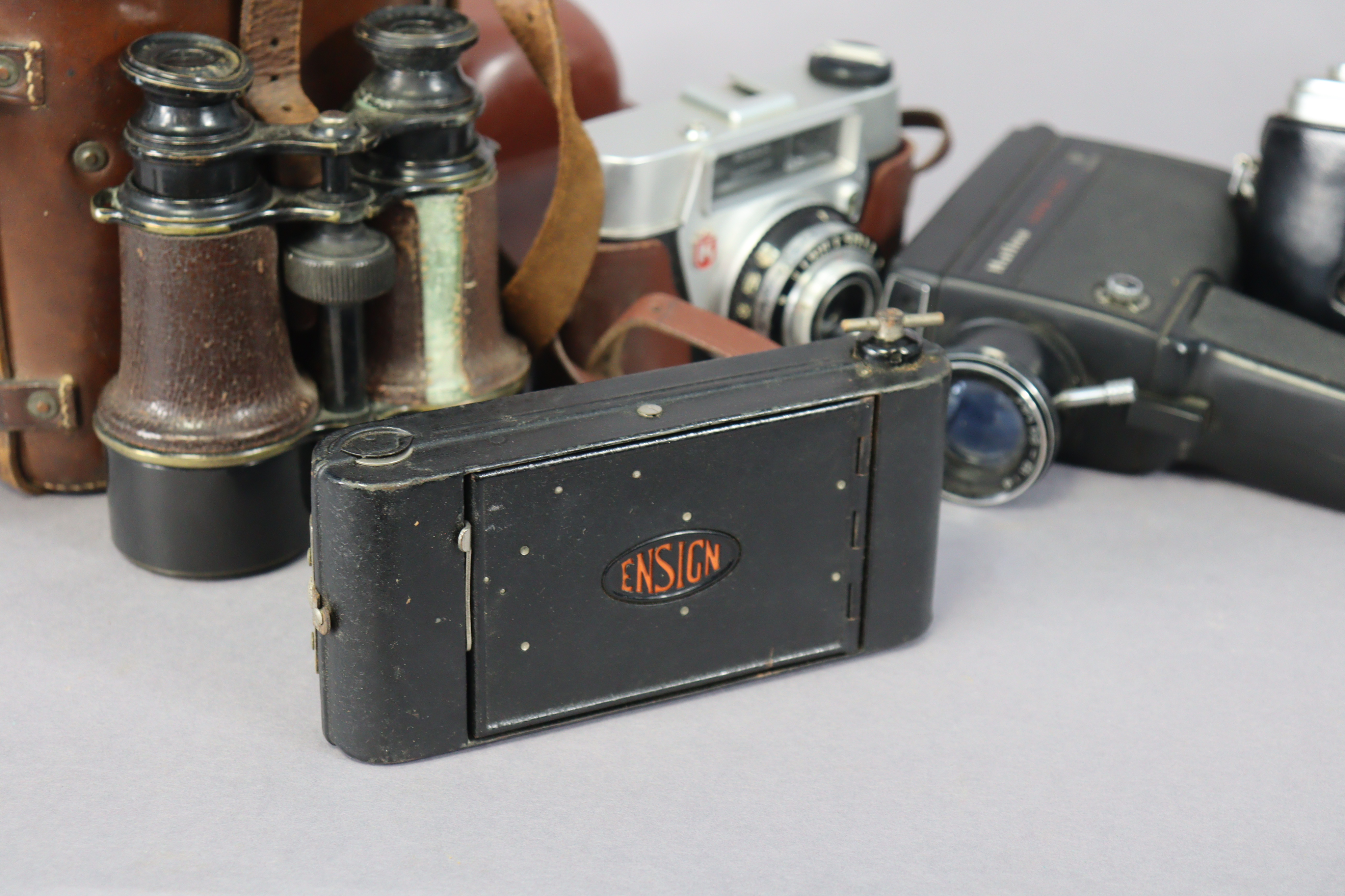 A pair of French black lacquered field glasses, with case, together with six various cameras. - Image 2 of 2