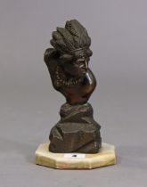 A bronzed Indian chief’s bust sculpture mounted on an onyx octagonal plinth, 22cm high.