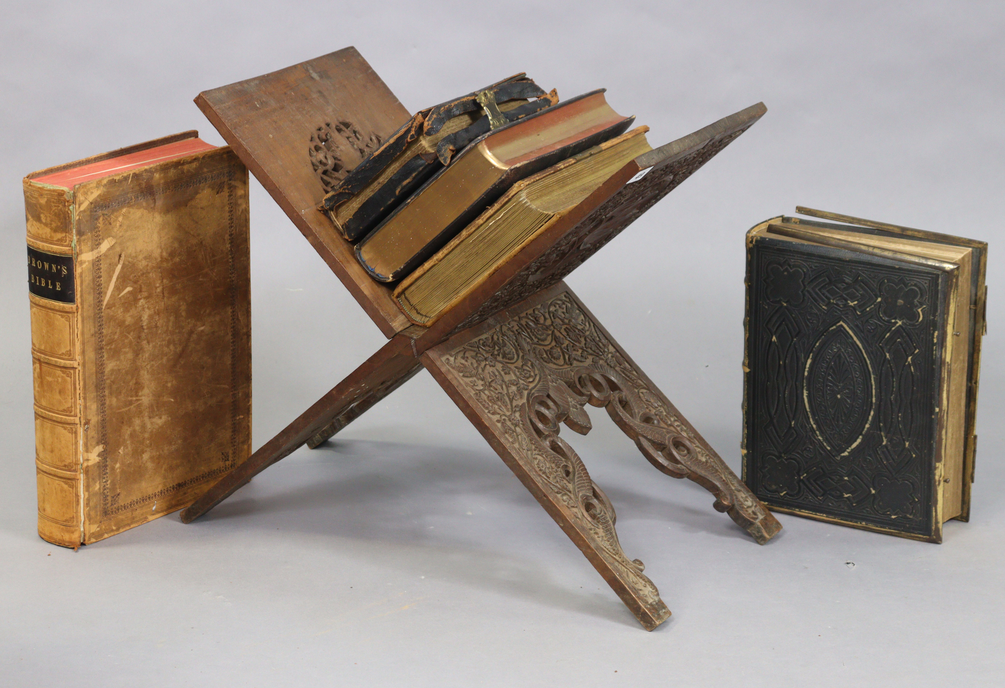 An Eastern carved hardwood fold-away bookstand, 56cm wide x 52cm high; together with a Victorian