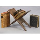 An Eastern carved hardwood fold-away bookstand, 56cm wide x 52cm high; together with a Victorian