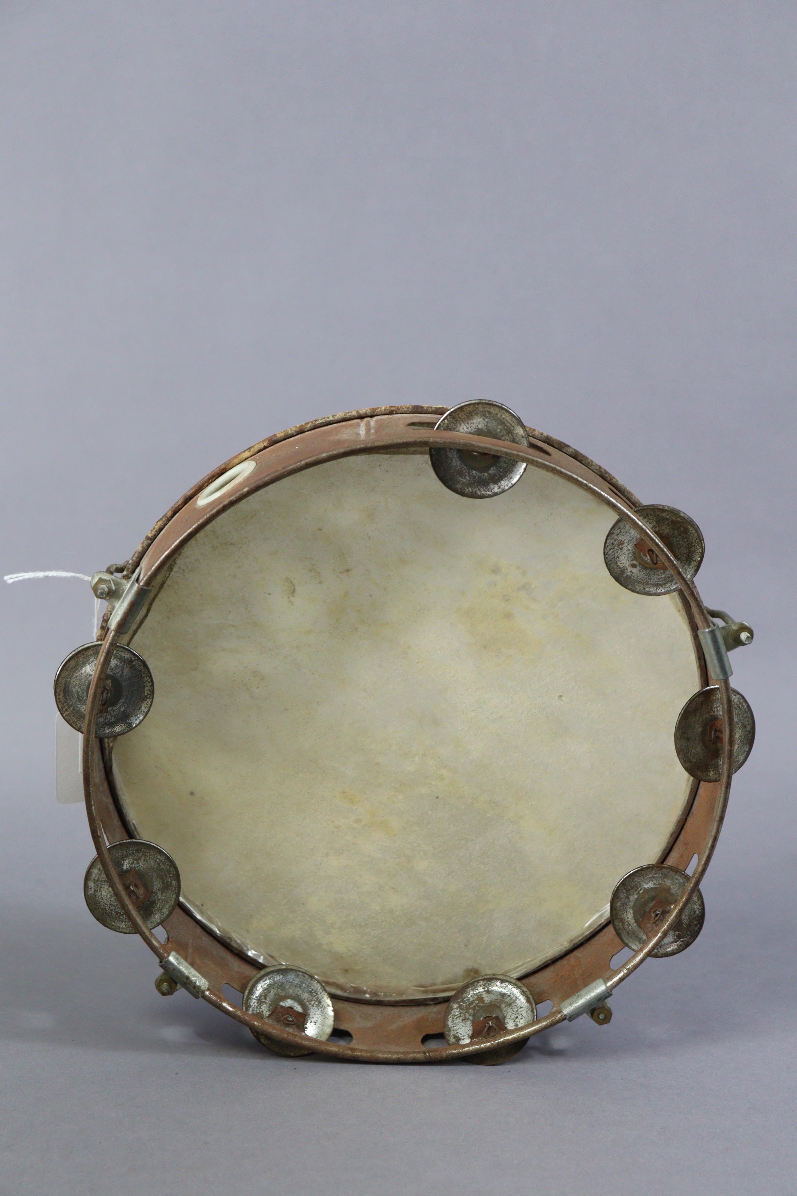 A Ridgmount portable gramophone in a cream finish fibre-covered case; together with a tambourine. - Image 6 of 7