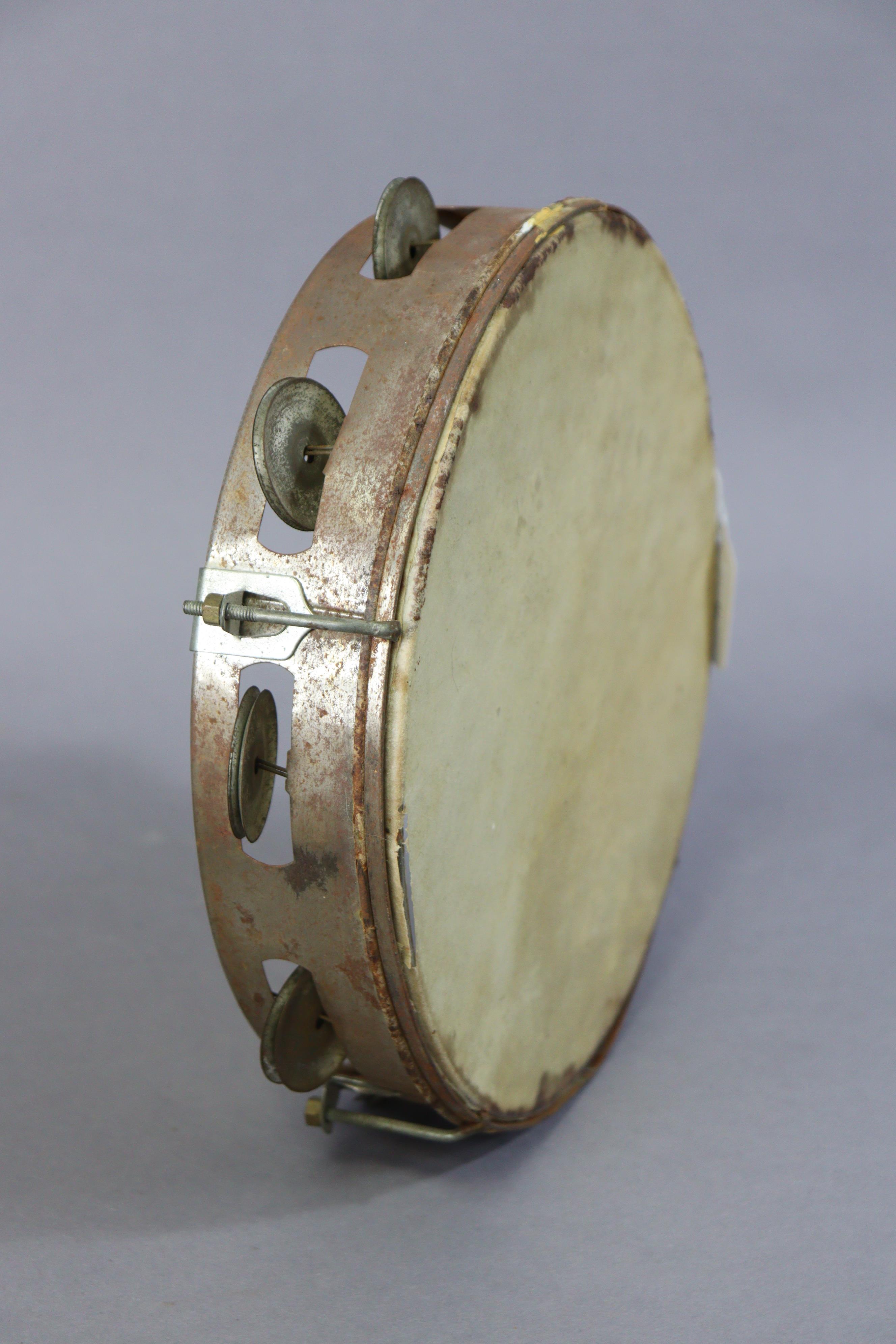 A Ridgmount portable gramophone in a cream finish fibre-covered case; together with a tambourine. - Image 7 of 7