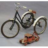 A mid-20th century child’s tricycle (blue) and a triang-type model two-truck, 42cm long.