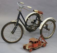 A mid-20th century child’s tricycle (blue) and a triang-type model two-truck, 42cm long.