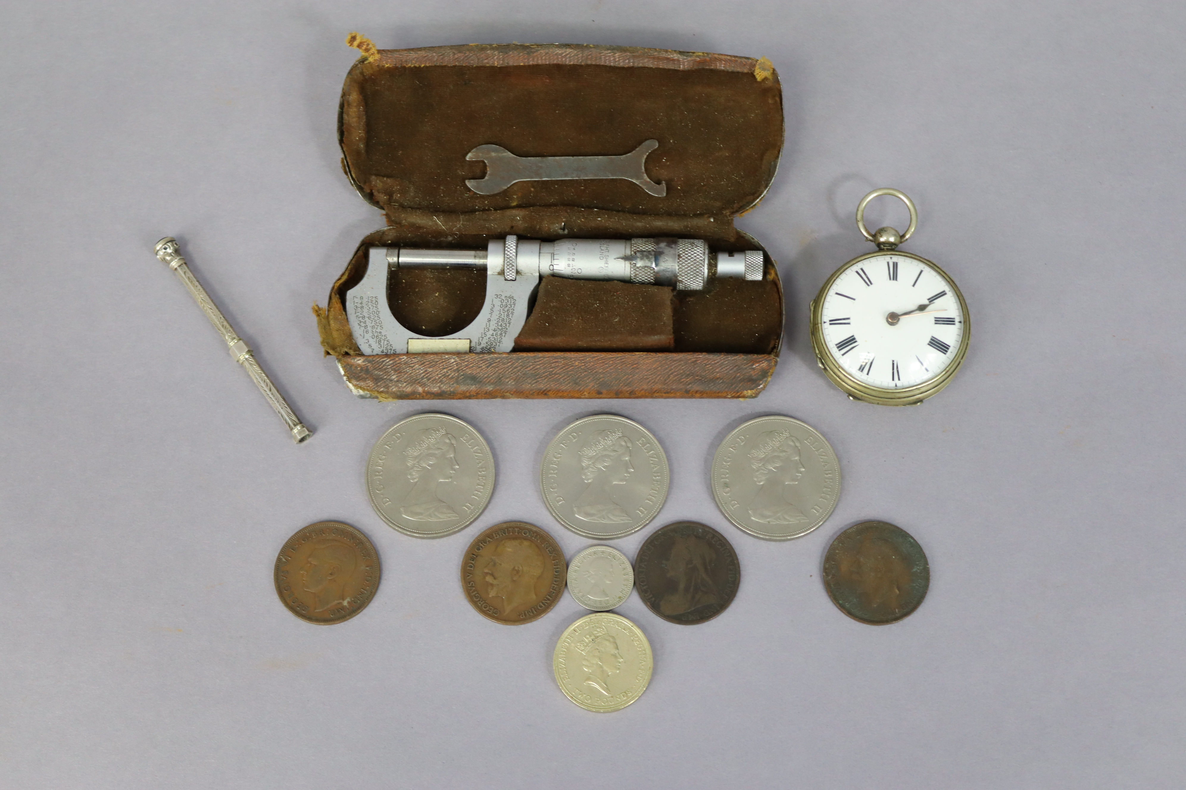 A gent’s pocket watch with black roman numerals to the white enamel dial, & in an engine turned