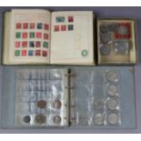 Various commemorative crowns & other coins; & a small stamp album.