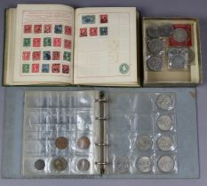 Various commemorative crowns & other coins; & a small stamp album.