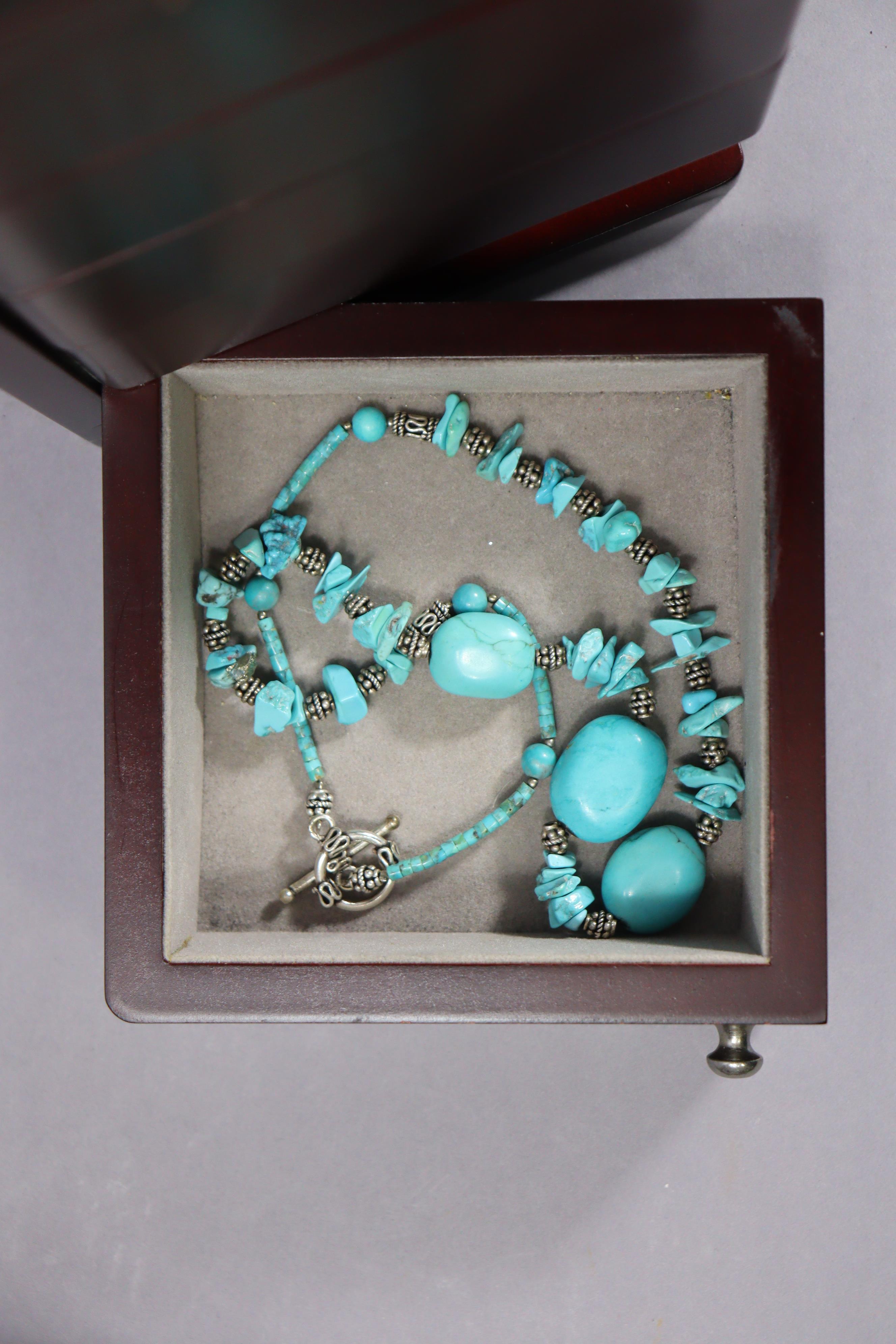 A collection of various bead necklaces including coral, turquoise, malachite, etc., contained in a - Image 2 of 14