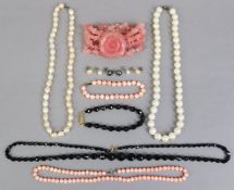 Two pearl necklaces, 43cm & 42.5cm long; a coral necklace, 40cm long; a jet necklace, 60cm long,